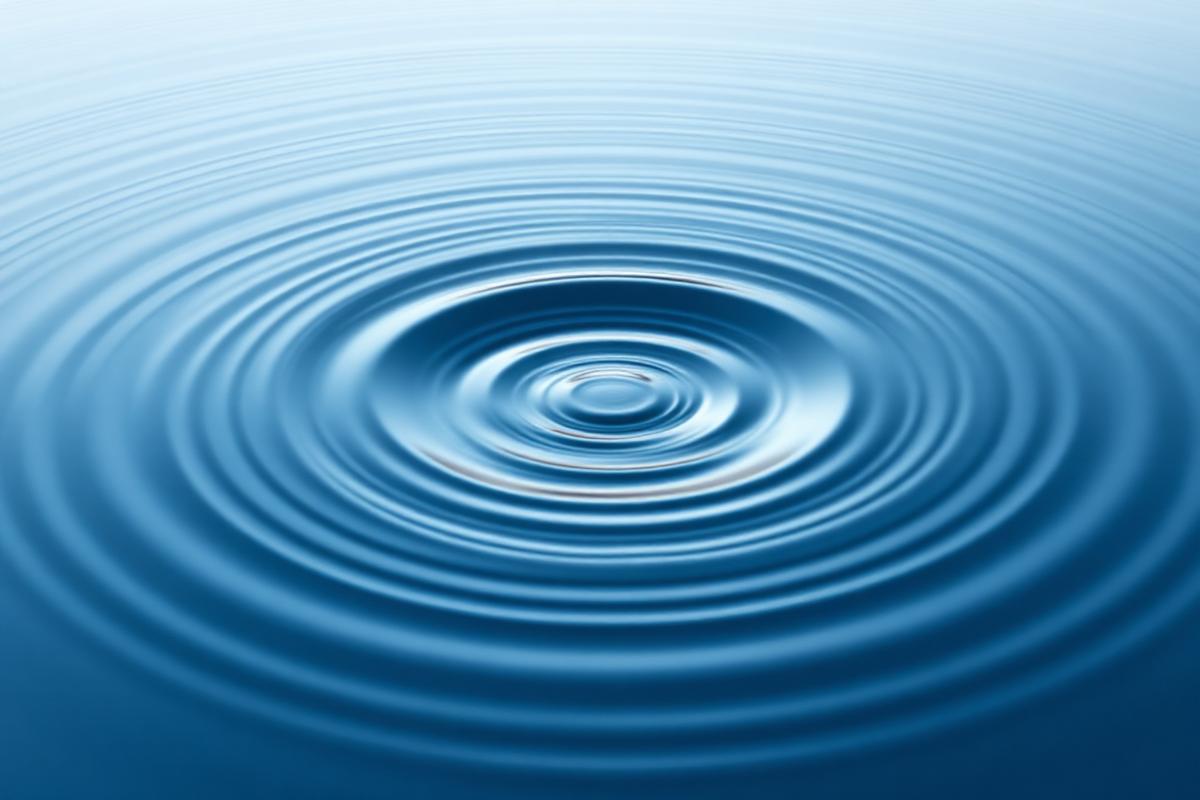 water ripples expanding logarithmically representing the decibel scale concept