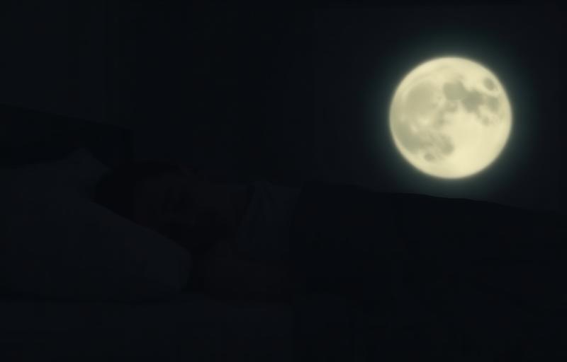 Dark bedroom representing the threshold of hearing safety