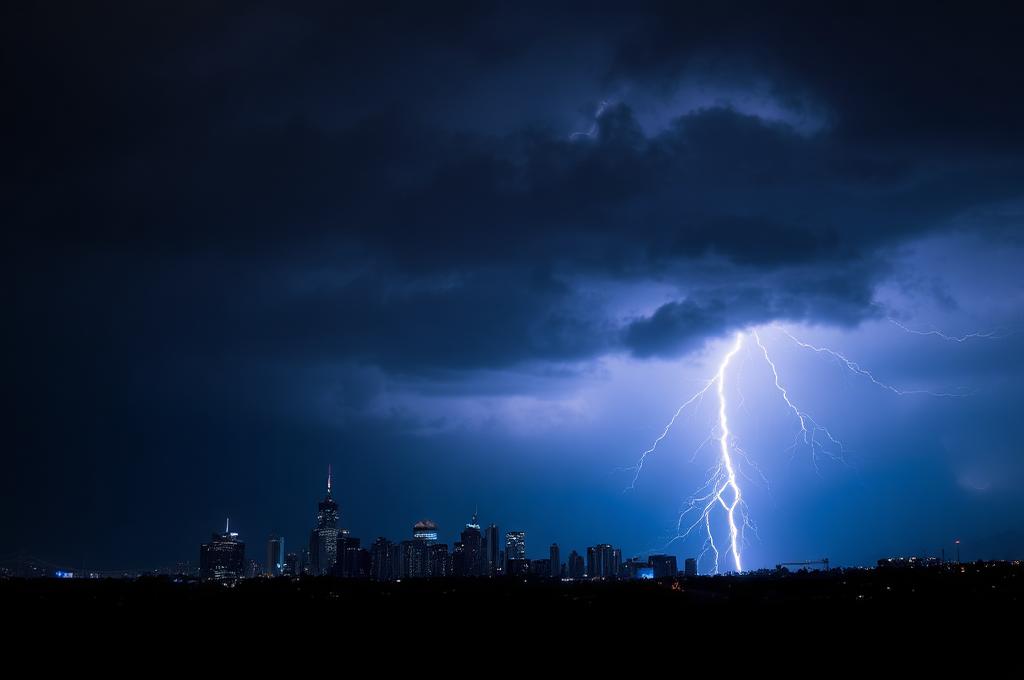 dramatic thunderstorm with lightning strike over a city skyline at night